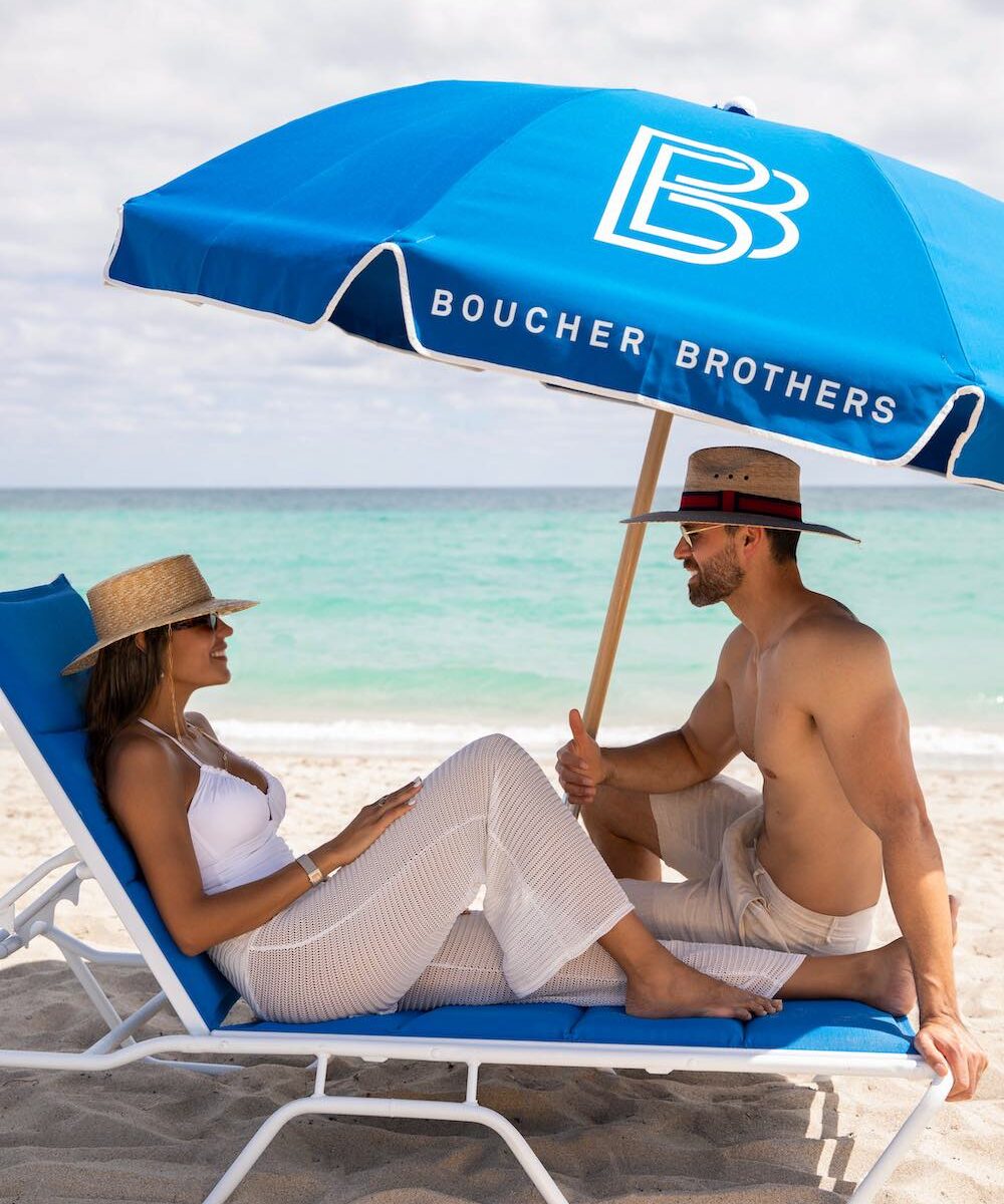 A styled beachfront brand activation at golden hour.